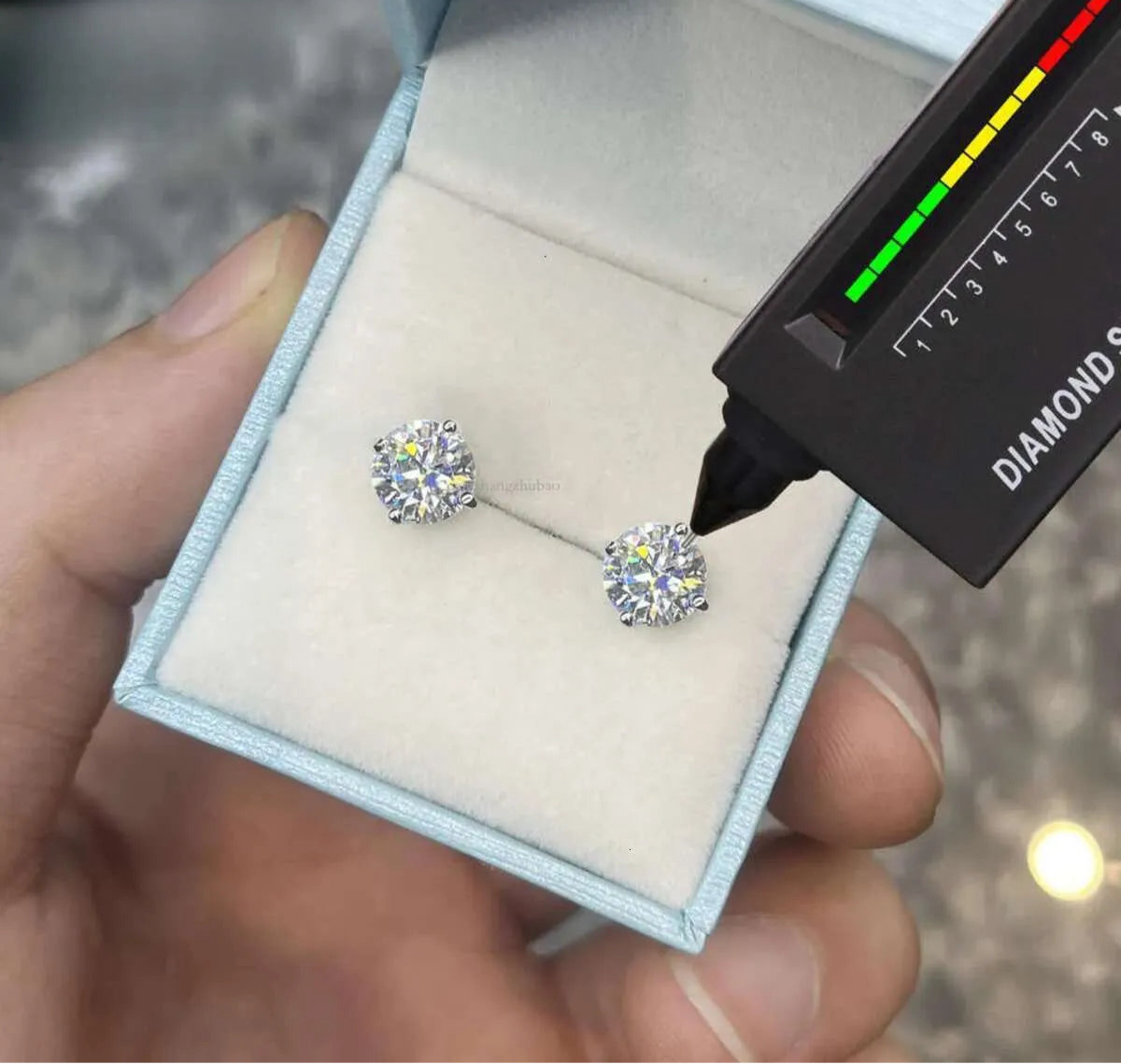 Round Cut Moissanite Stud Earrings in White Gold